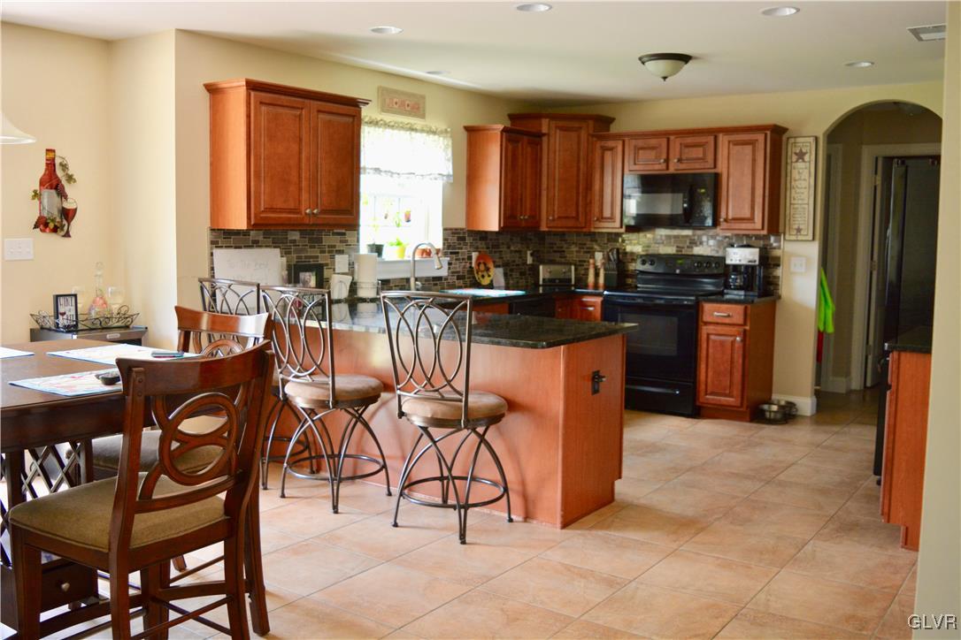 146 Fox Ridge Nazareth, PA 18064 - Photo 8 of 24 a kitchen with stainless steel appliances granite countertop a stove a sink dishwasher and a refrigerator