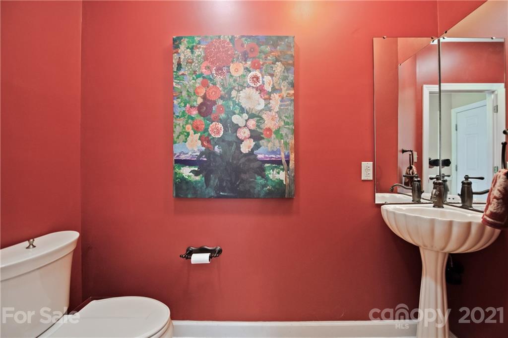 135 Kimberly Road Davidson, NC 28036 - Photo 22 of 40 a bathroom with a sink mirror and toilet