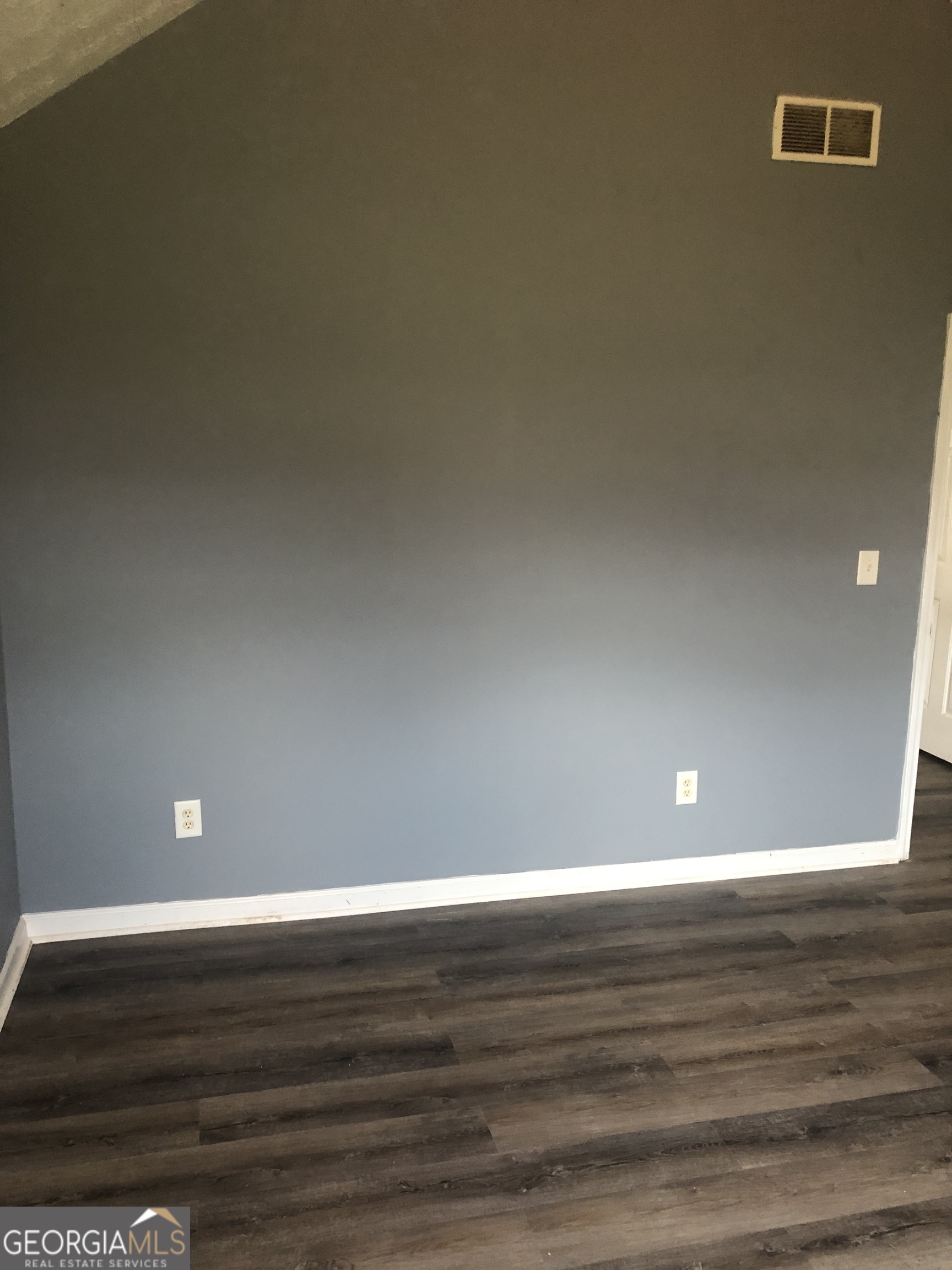 25 Franklin Way Covington, GA 30016 - Photo 21 of 54 a view of room with wooden floor