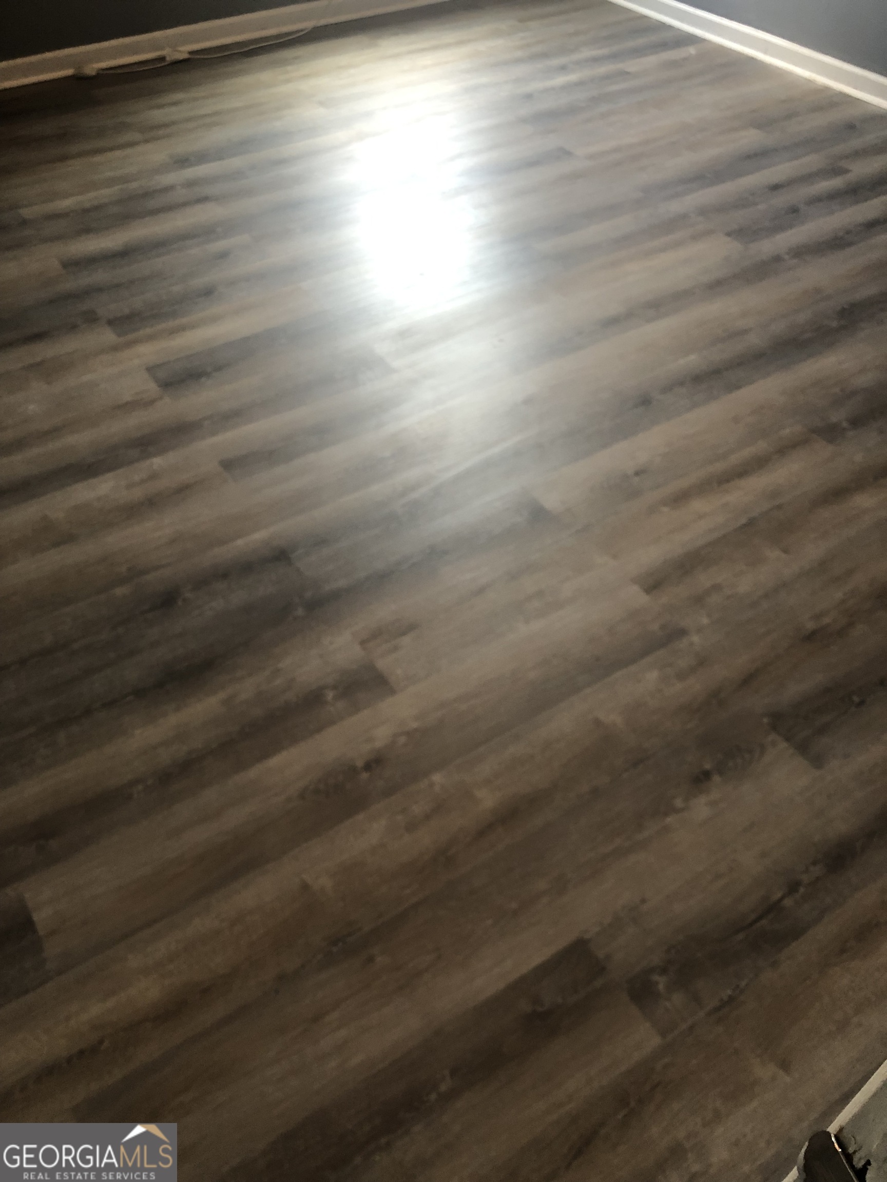 25 Franklin Way Covington, GA 30016 - Photo 29 of 54 a room with wooden floor and windows