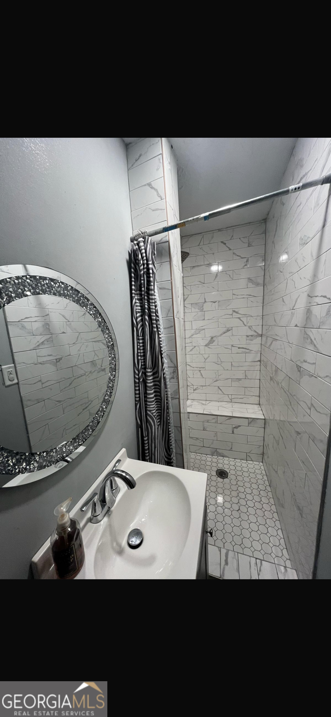 25 Franklin Way Covington, GA 30016 - Photo 49 of 54 a view of bathroom with a sink and a mirror