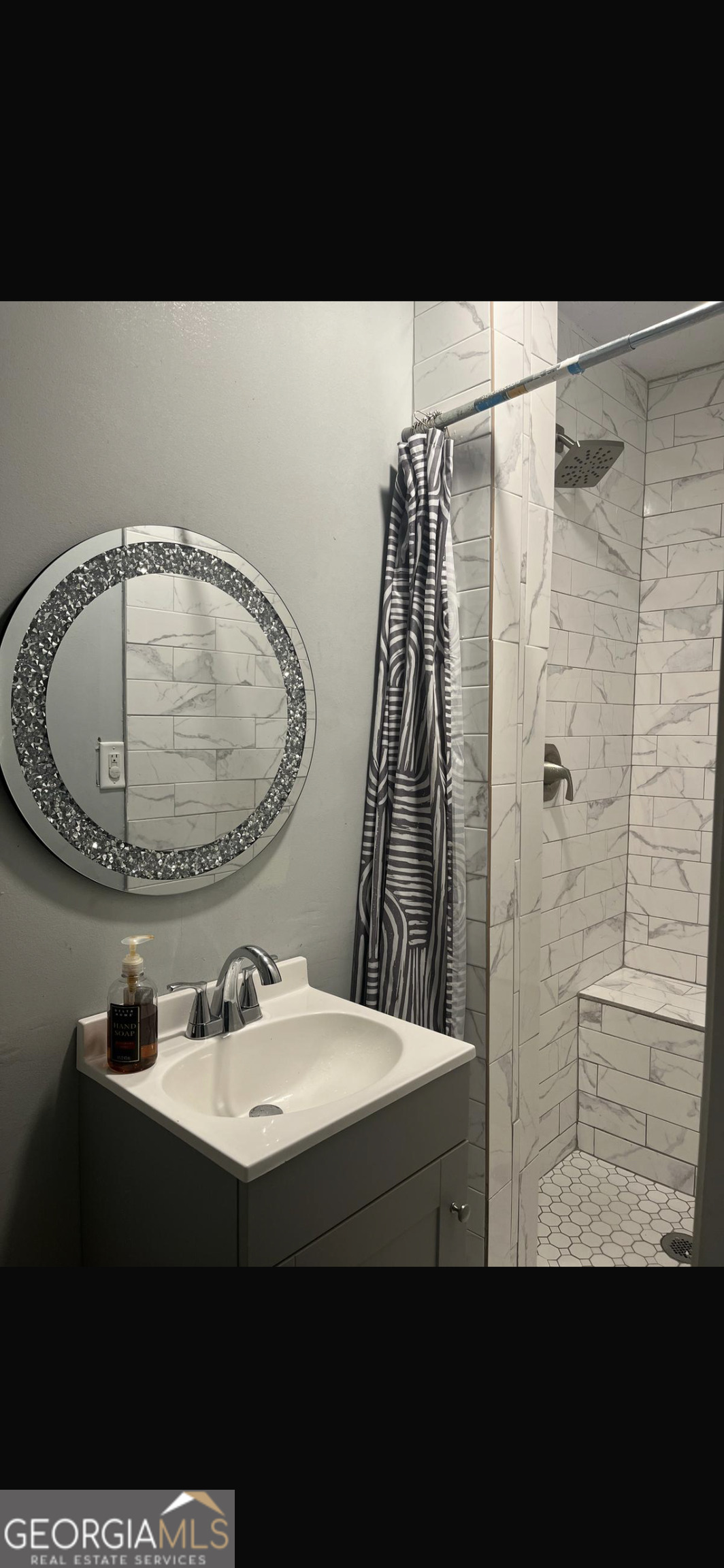 25 Franklin Way Covington, GA 30016 - Photo 50 of 54 a bathroom with a sink and a mirror