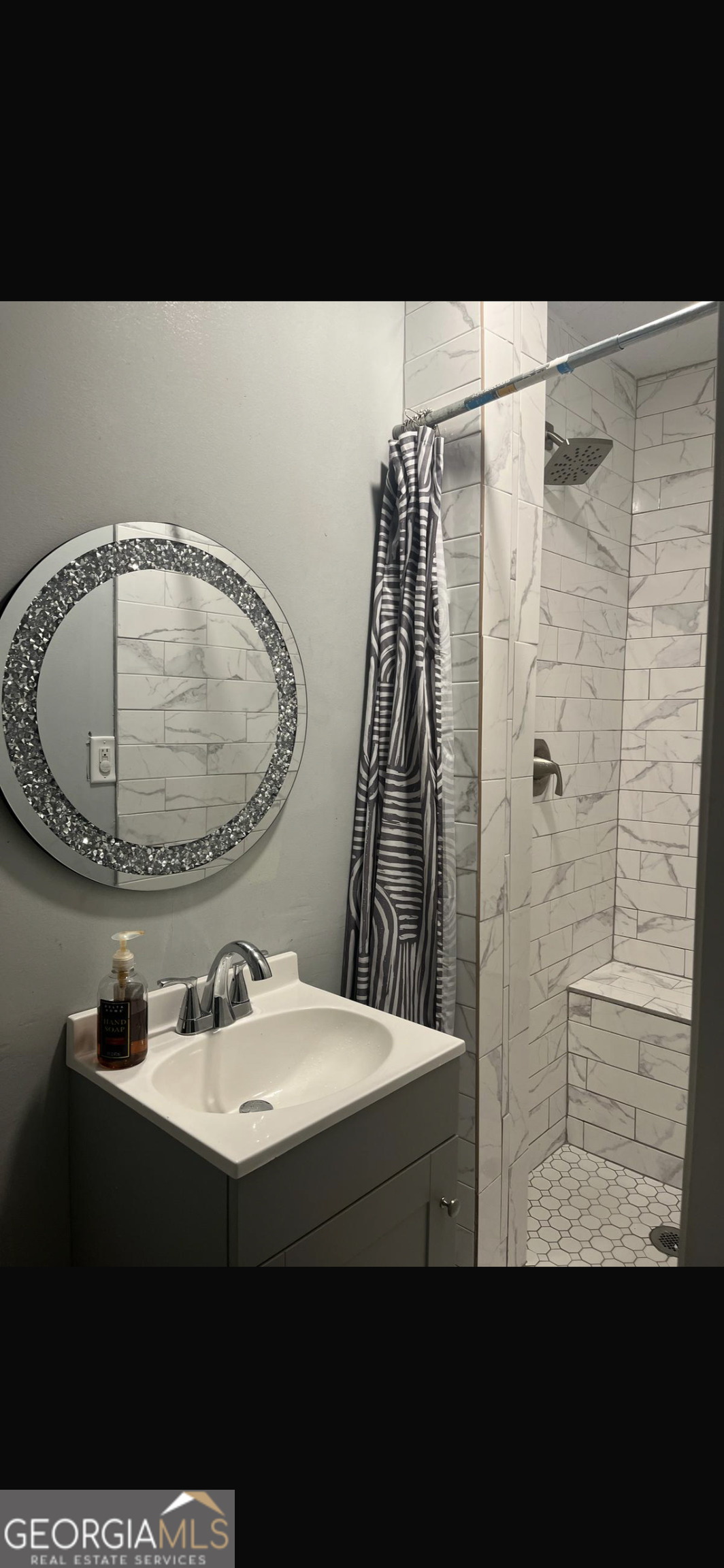 25 Franklin Way Covington, GA 30016 - Photo 53 of 54 a bathroom with a sink and a mirror