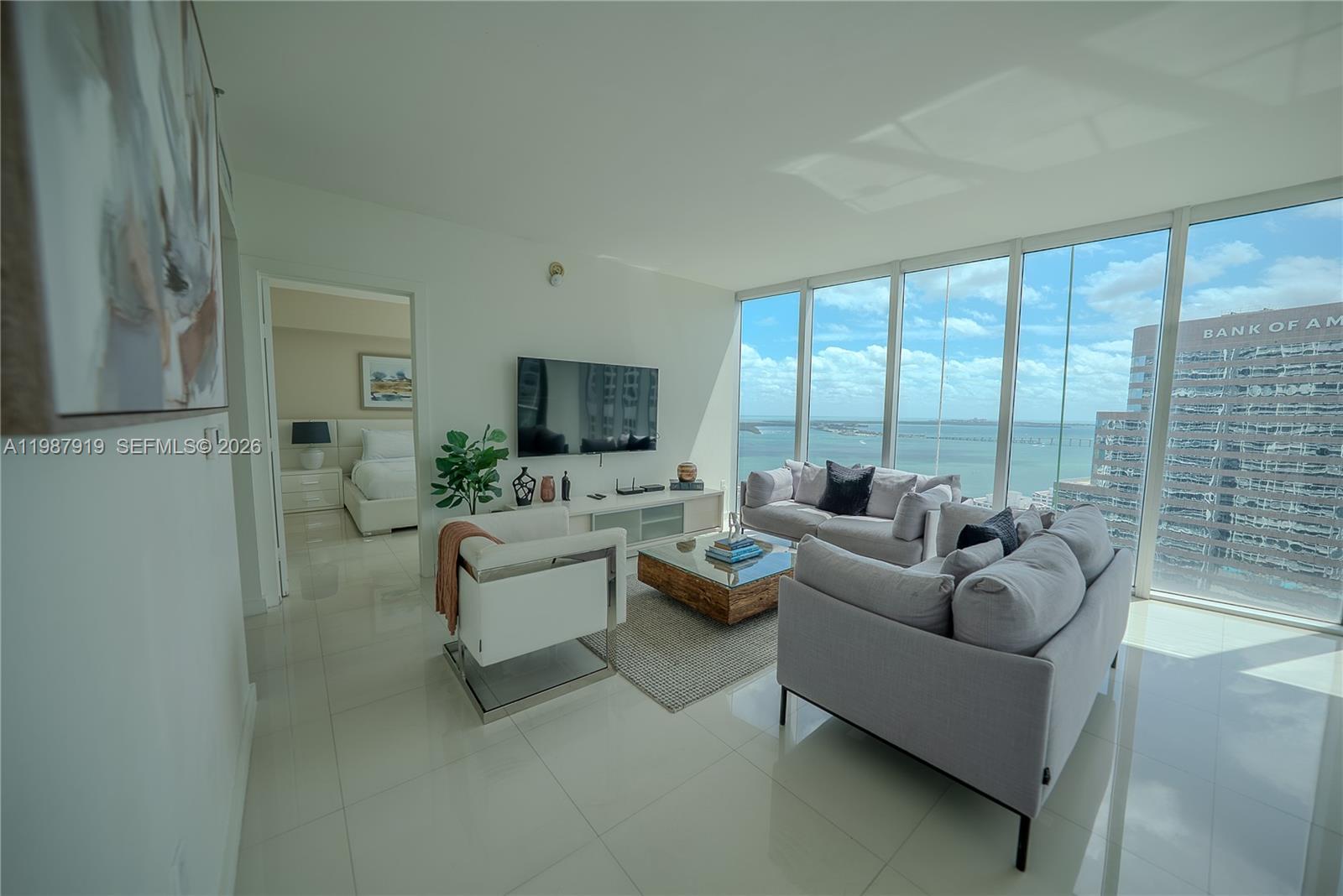 Icon Brickell Miami, FL 33131 - Photo 15 of 26 a living room with furniture and a large window