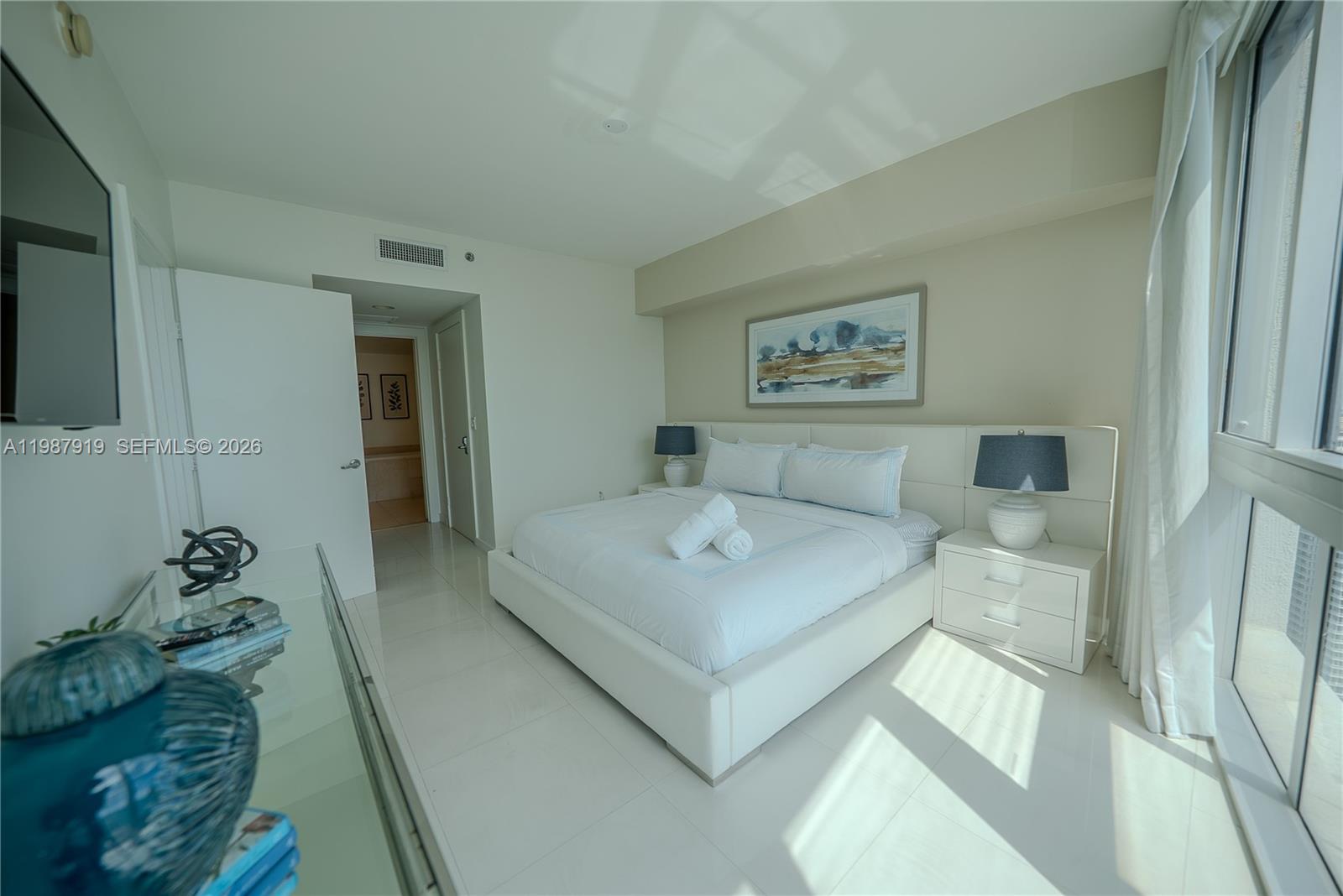 Icon Brickell Miami, FL 33131 - Photo 17 of 26 a spacious bedroom with a bed and a couch