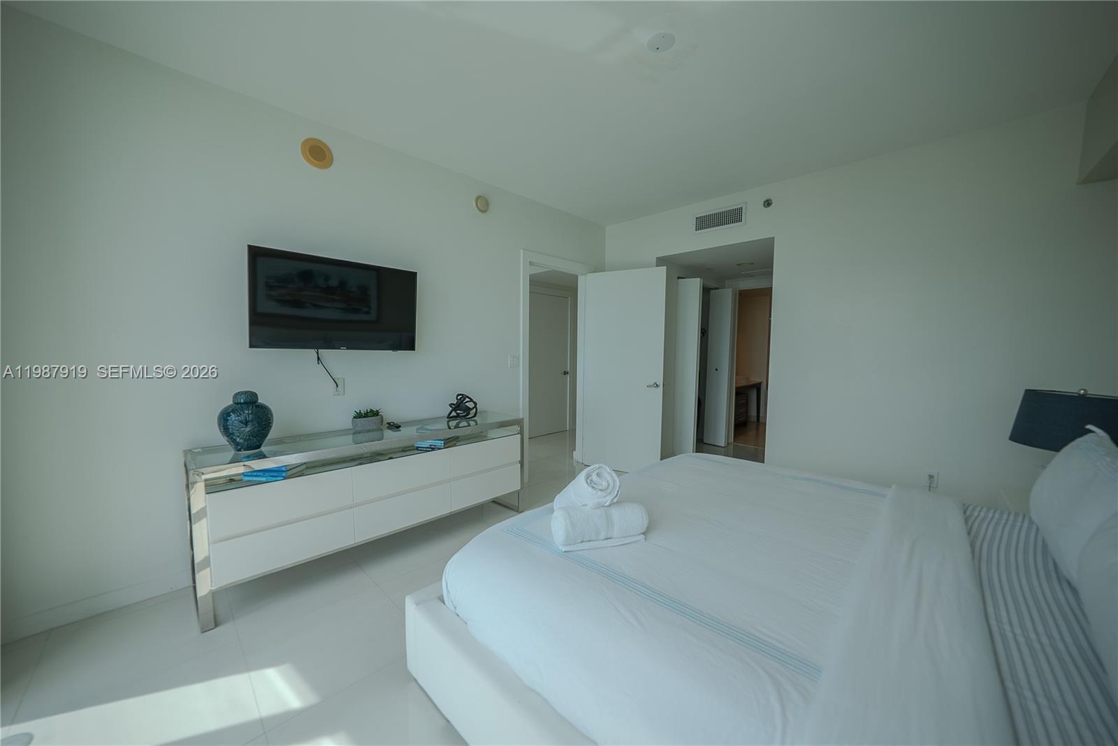 Icon Brickell Miami, FL 33131 - Photo 18 of 26 a living room with furniture and a flat screen tv