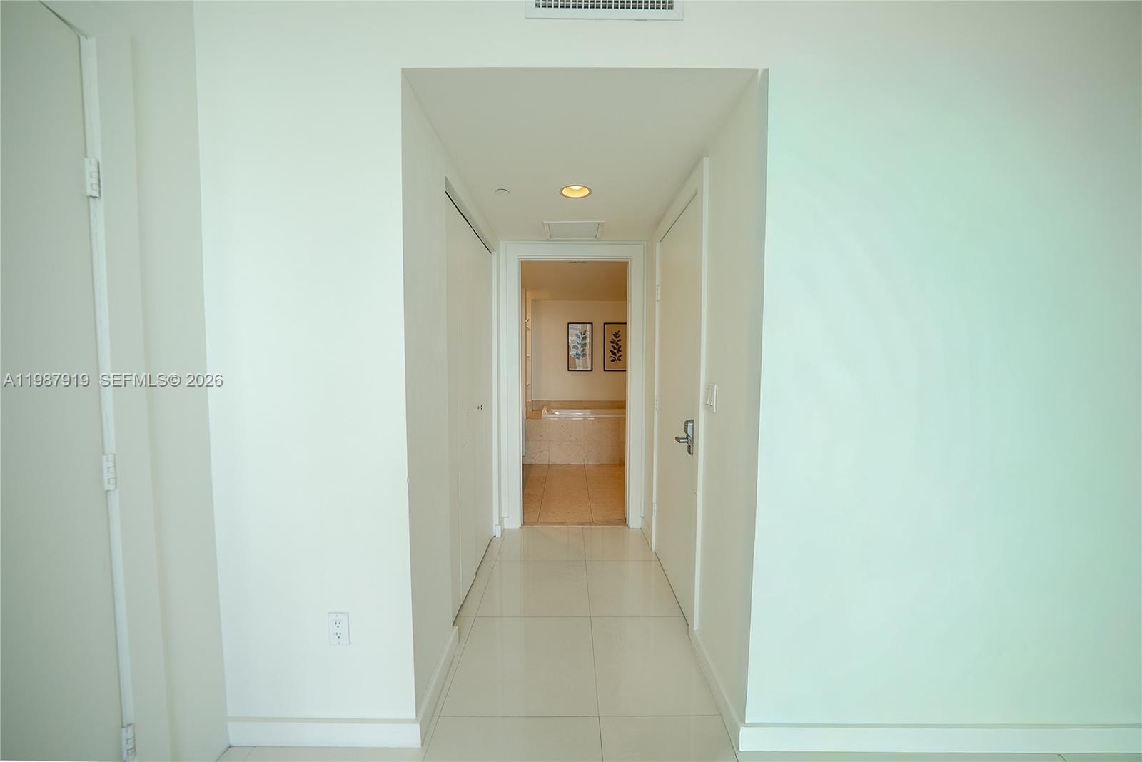 Icon Brickell Miami, FL 33131 - Photo 20 of 26 a view of a hallway with wooden floor