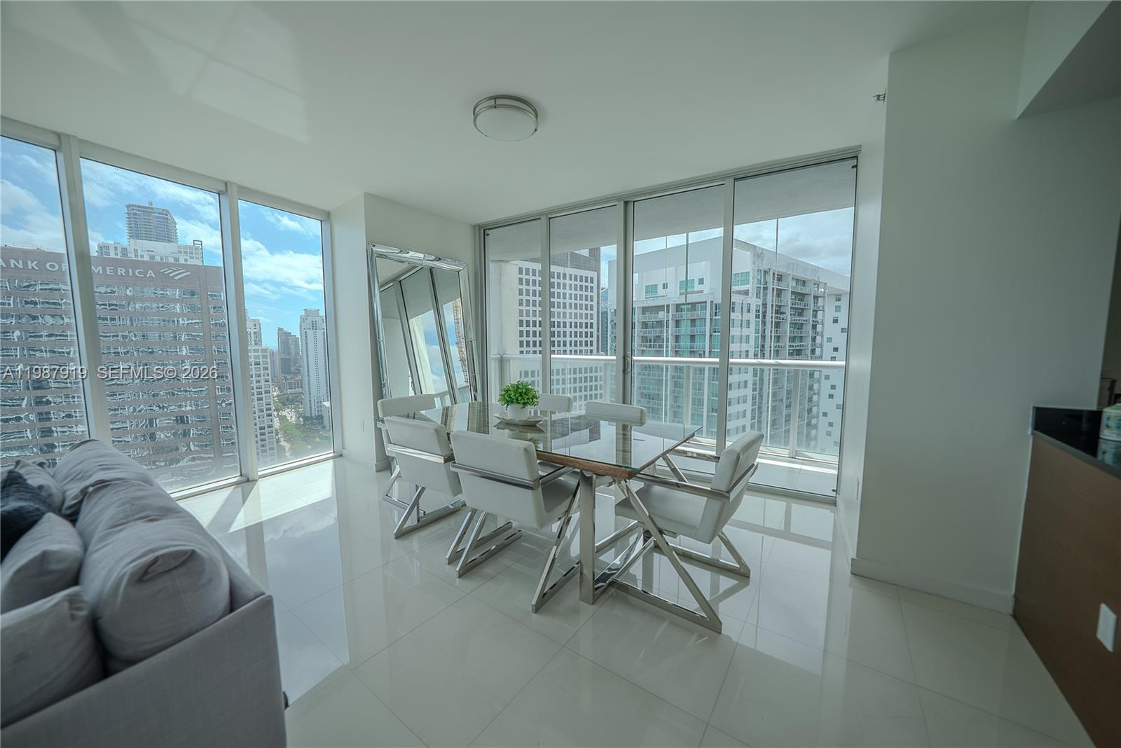 Icon Brickell Miami, FL 33131 - Photo 2 of 26 a living room with furniture and a floor to ceiling window