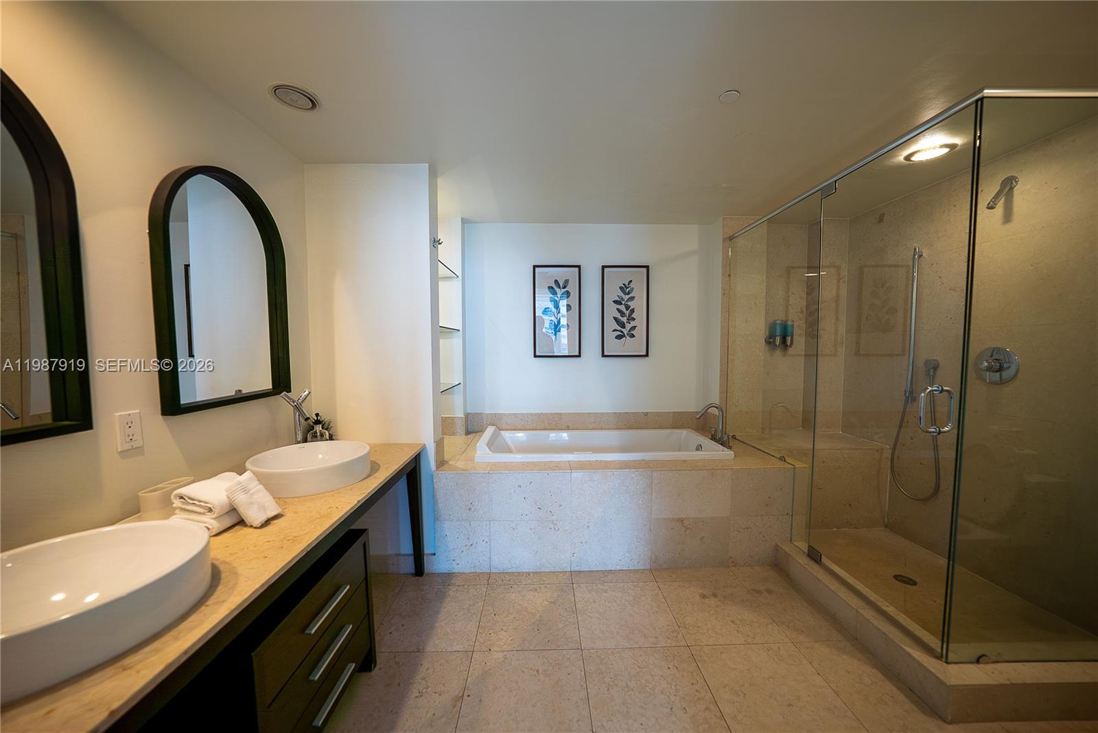 Icon Brickell Miami, FL 33131 - Photo 21 of 26 a spacious bathroom with a granite countertop sink a toilet and bathtub