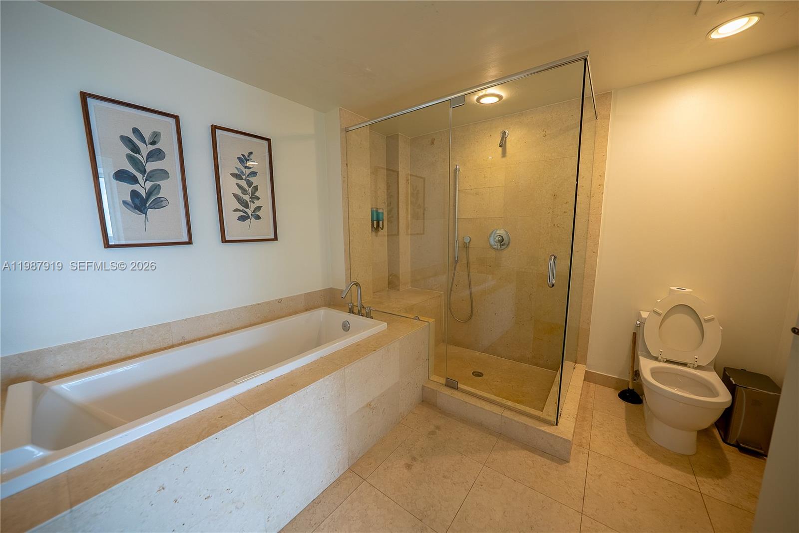 Icon Brickell Miami, FL 33131 - Photo 22 of 26 a spacious bathroom with a tub and shower