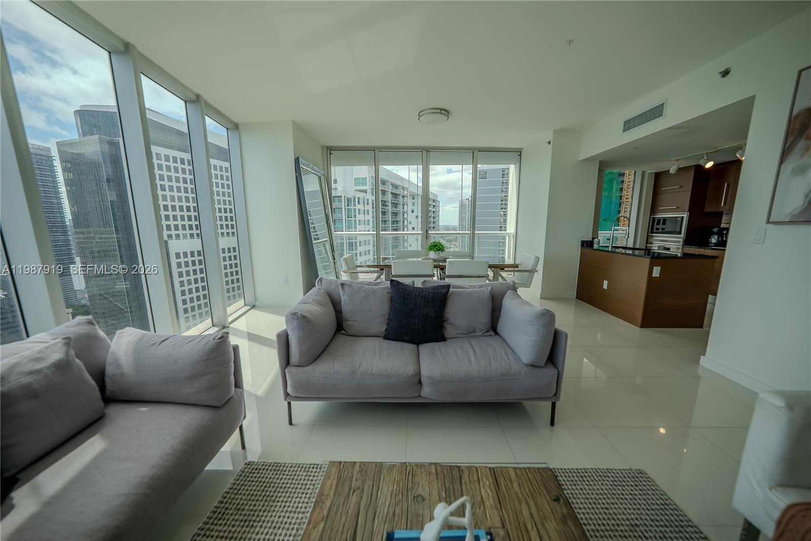 Icon Brickell Miami, FL 33131 - Photo 24 of 26 a living room with furniture and a rug