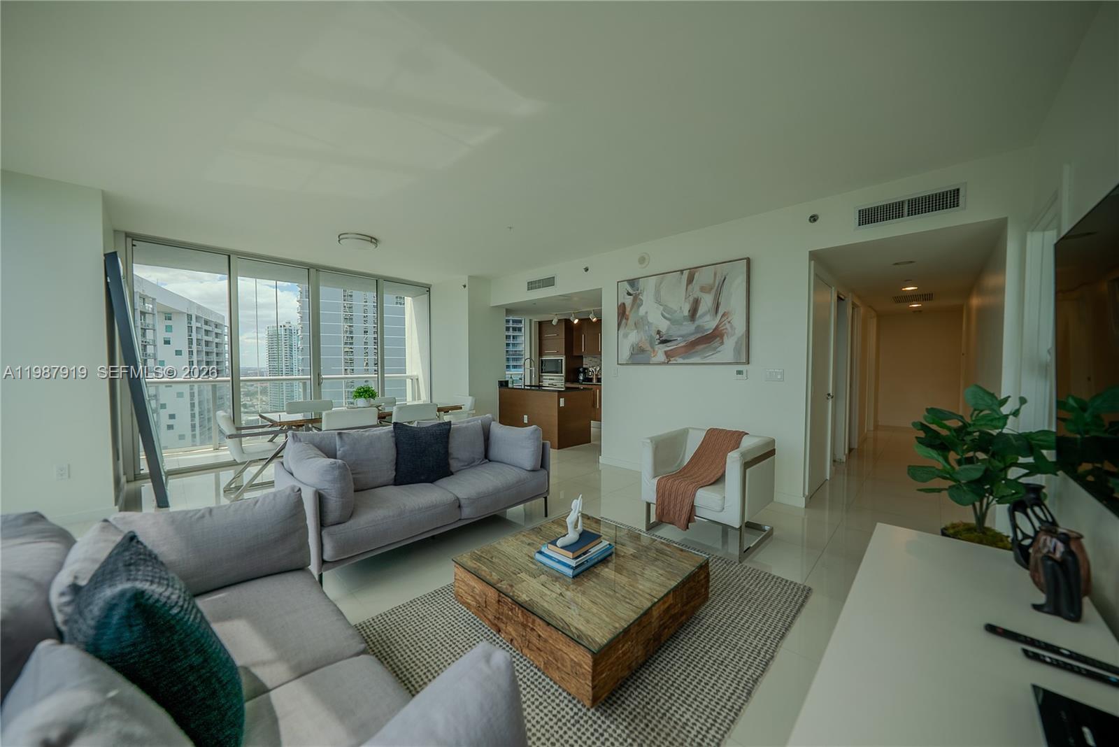 Icon Brickell Miami, FL 33131 - Photo 25 of 26 a living room with furniture and a large window