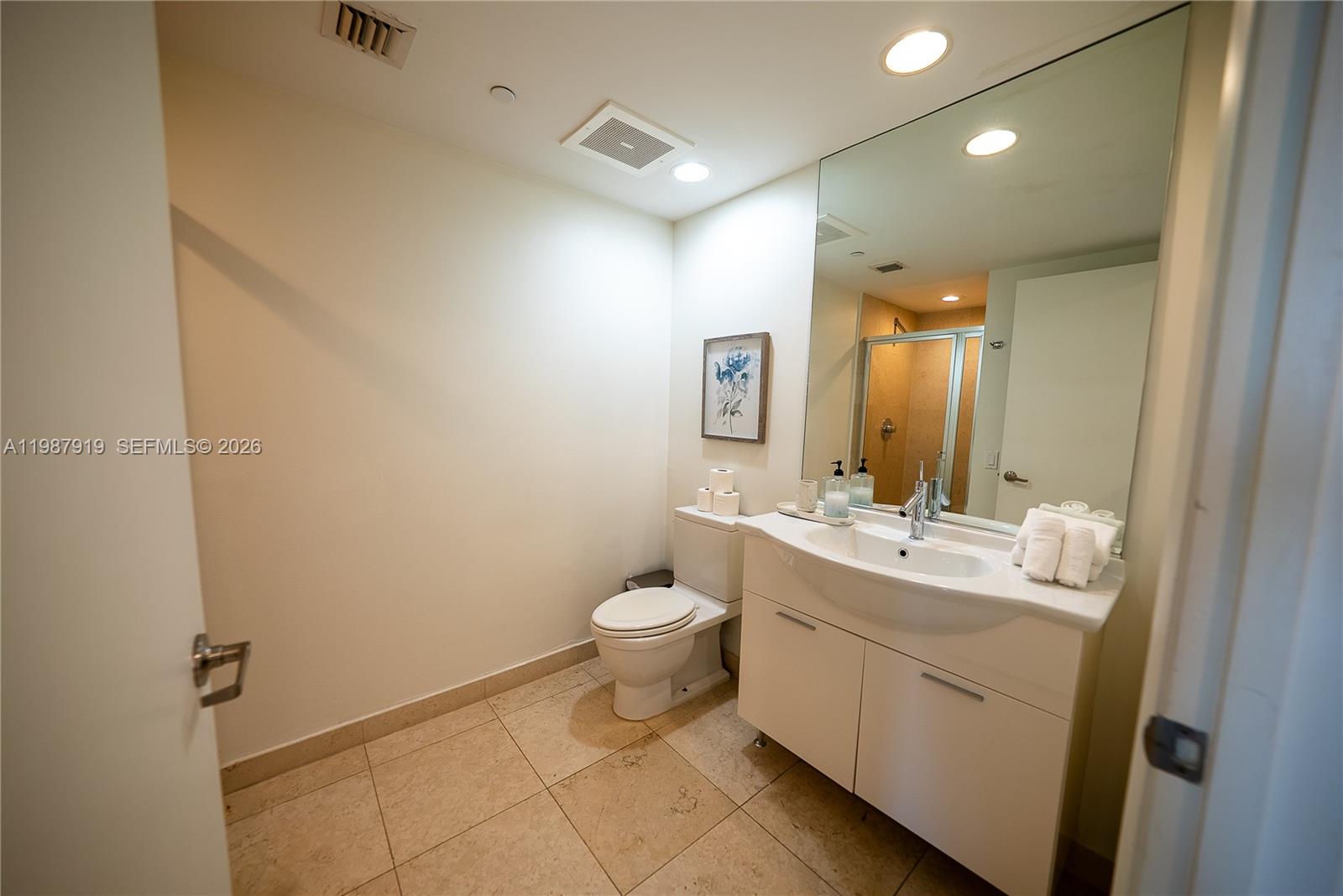 Icon Brickell Miami, FL 33131 - Photo 10 of 26 a bathroom with a double vanity sink toilet and mirror