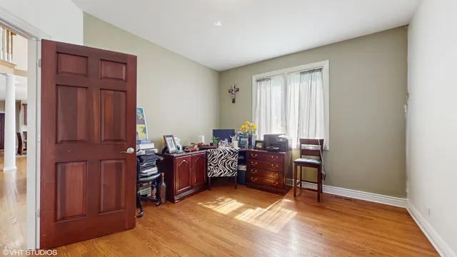 a livingroom with workspace and a window