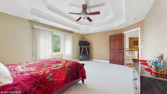a bed room with a bed and a book shelf
