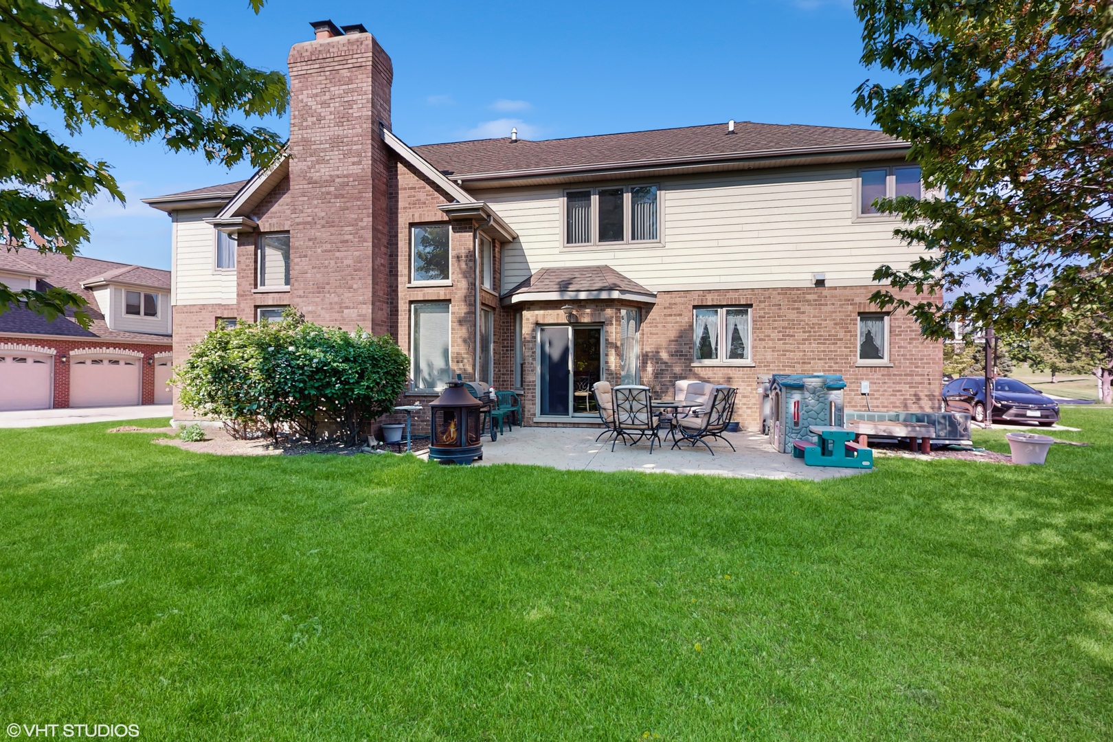 17040 Cheyenne Court Lockport, IL 60441 - Photo 3 of 47 a backyard of a house with table and chairs