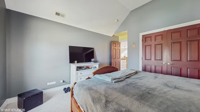 an empty room with windows and cabinet