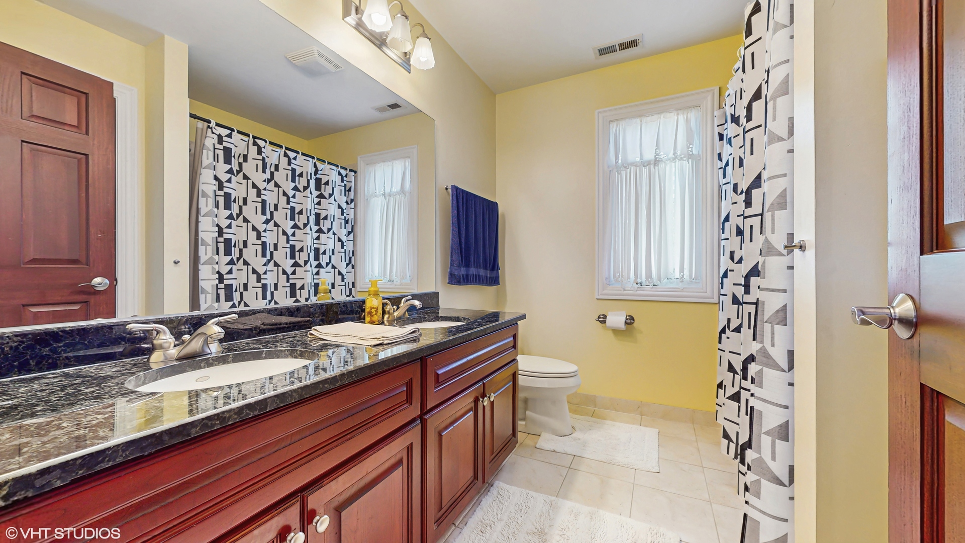 17040 Cheyenne Court Lockport, IL 60441 - Photo 37 of 47 a bathroom with a granite countertop sink and a mirror