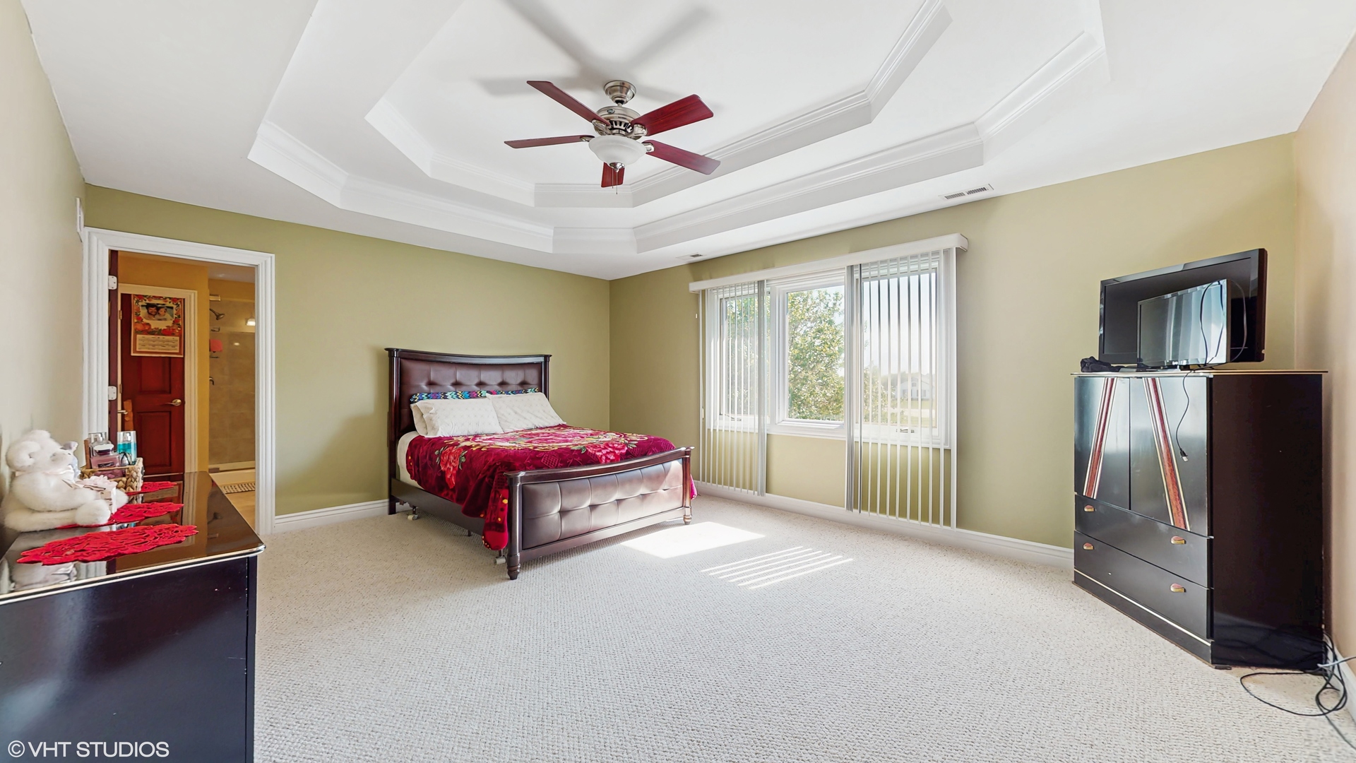 17040 Cheyenne Court Lockport, IL 60441 - Photo 38 of 47 a spacious bedroom with a bed and a chandelier