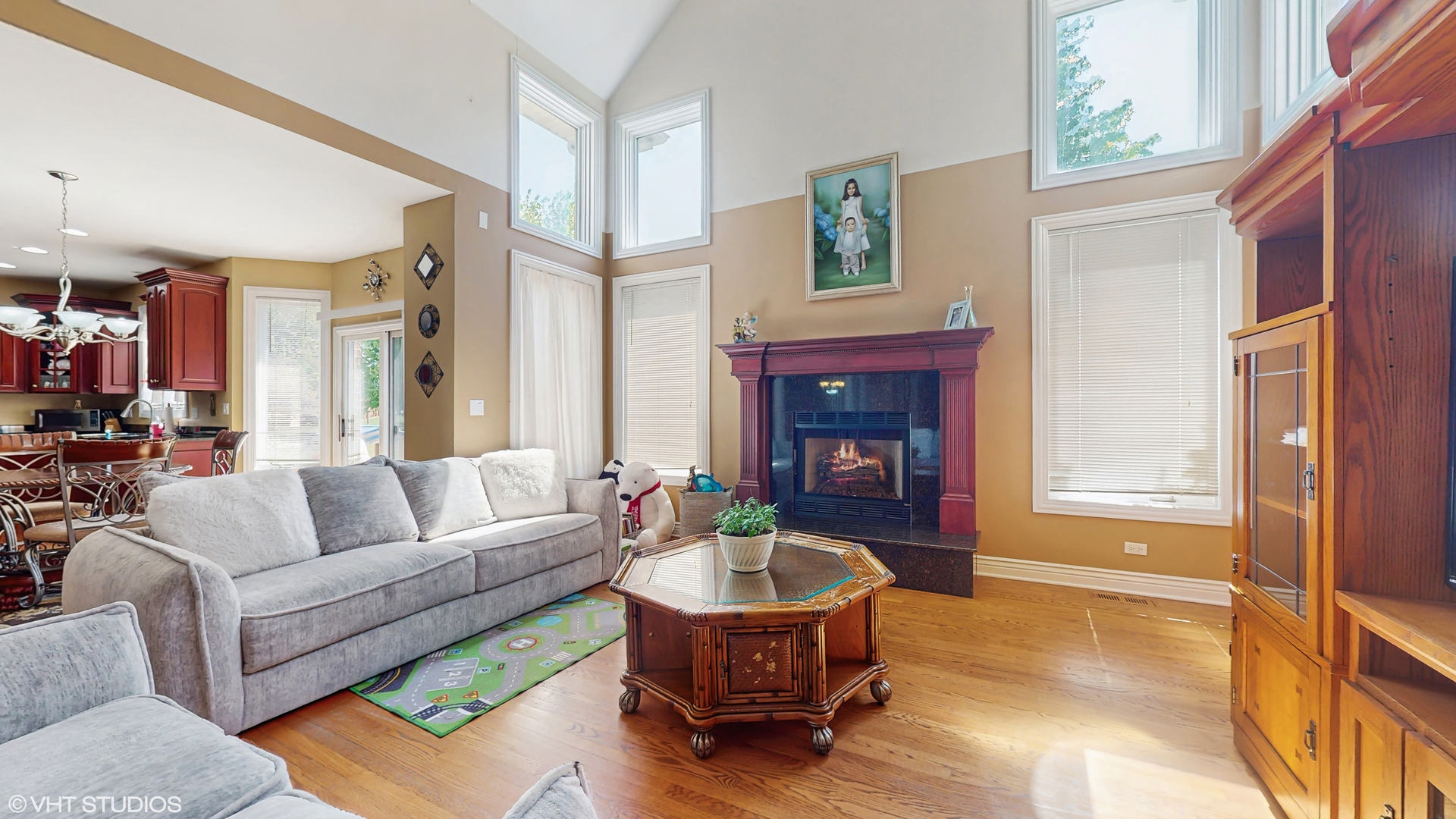 17040 Cheyenne Court Lockport, IL 60441 - Photo 5 of 47 a living room with furniture a fireplace and a table