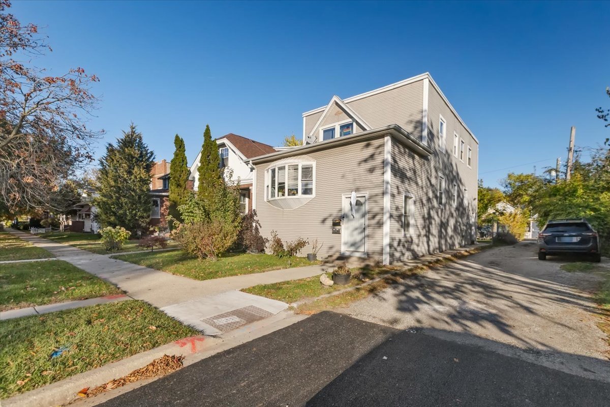 1213 Darrow Avenue Evanston, IL 60202 - Photo 2 of 16 a view of a house with a yard