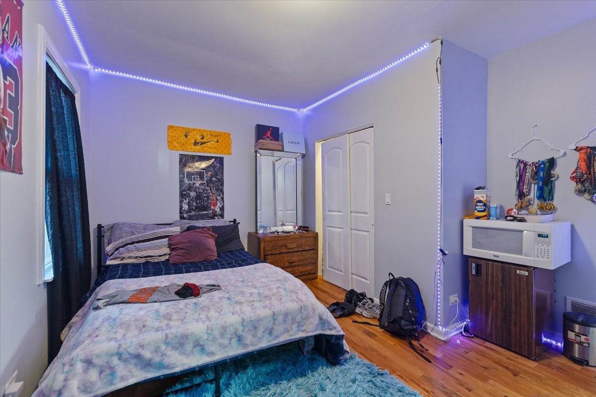 1213 Darrow Avenue Evanston, IL 60202 - Photo 6 of 16 a bedroom with a bed and a closet