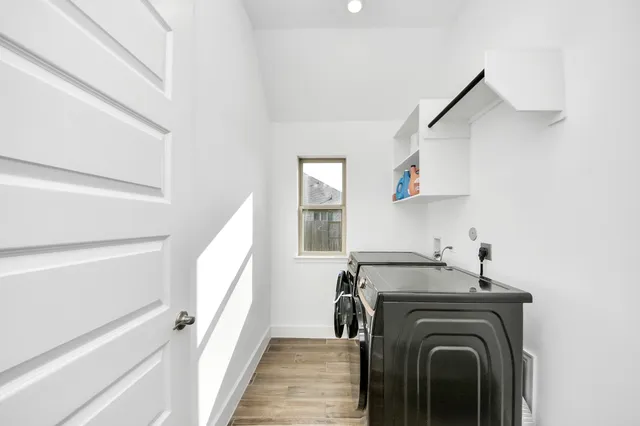 a view of a hallway with washer and dryer