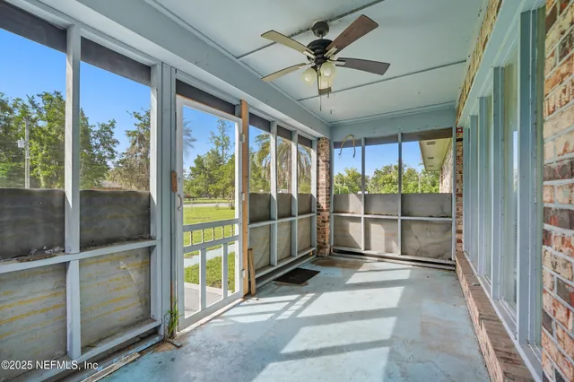 a view of a swimming pool with a yard