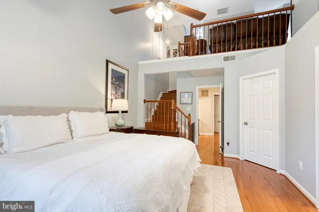 a bed room with a bed and a large mirror