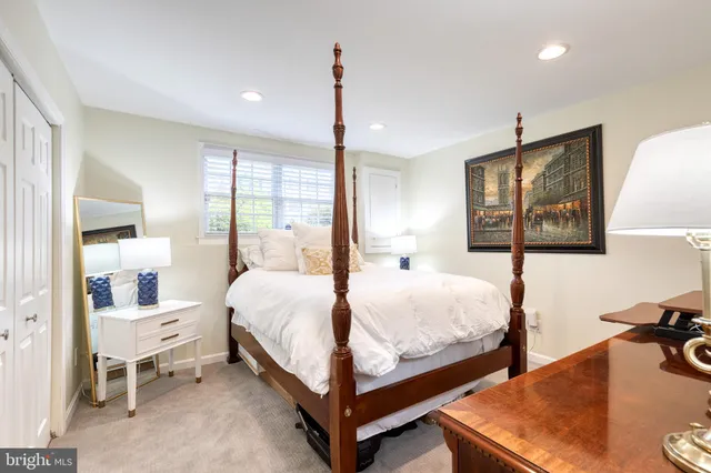 a bedroom with bed and window