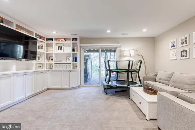 a view of a livingroom with furniture and a flat screen tv