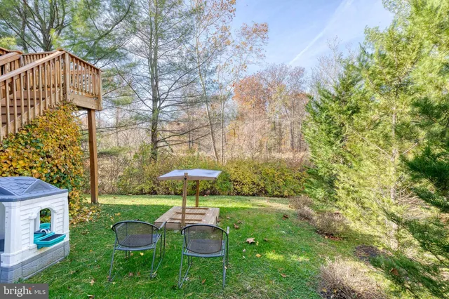 a view of a chair and table under an umbrella