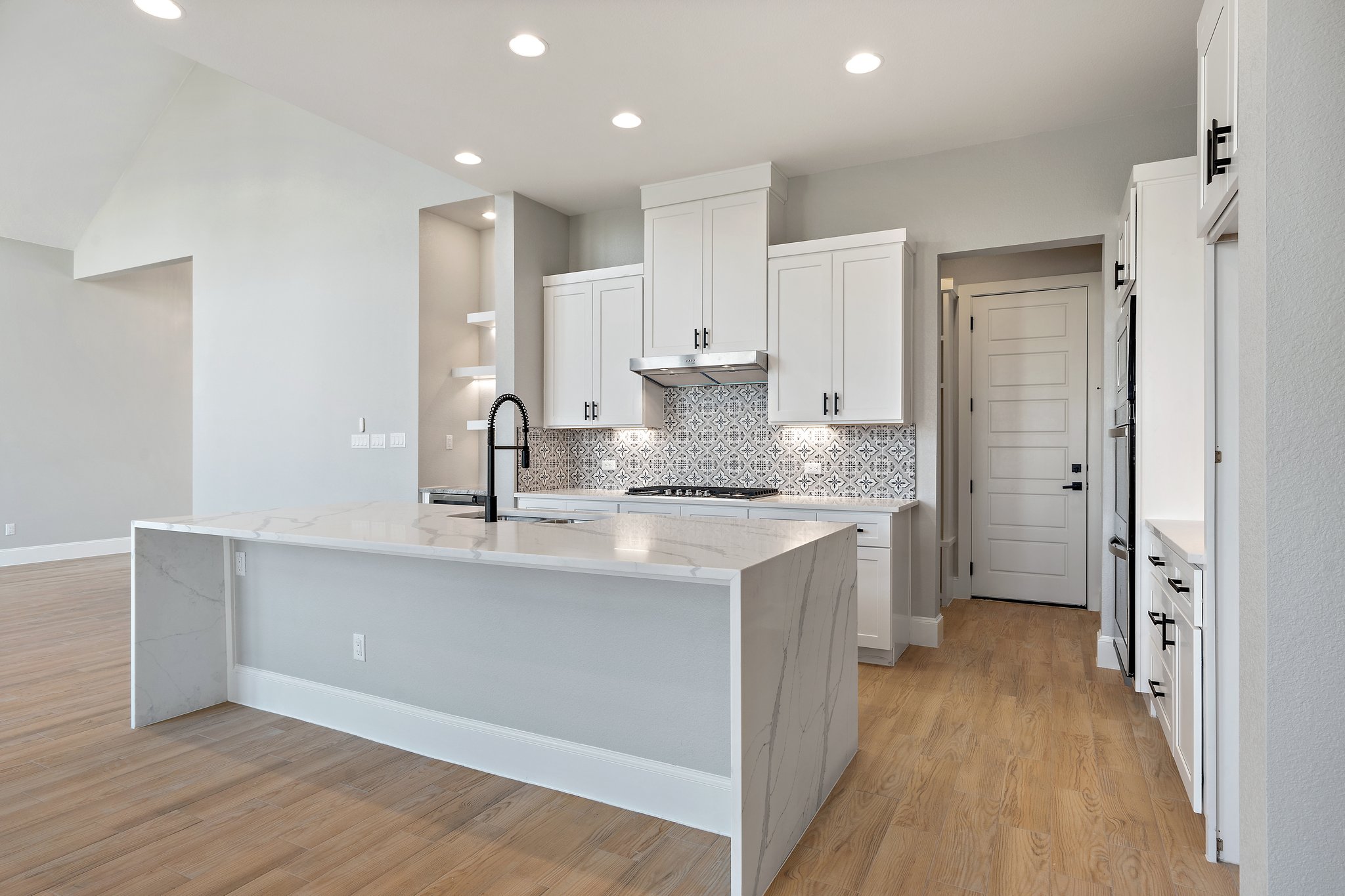 308 Axis Loop Georgetown, TX 78628 - Photo 16 of 40 a kitchen with a sink refrigerator and cabinets
