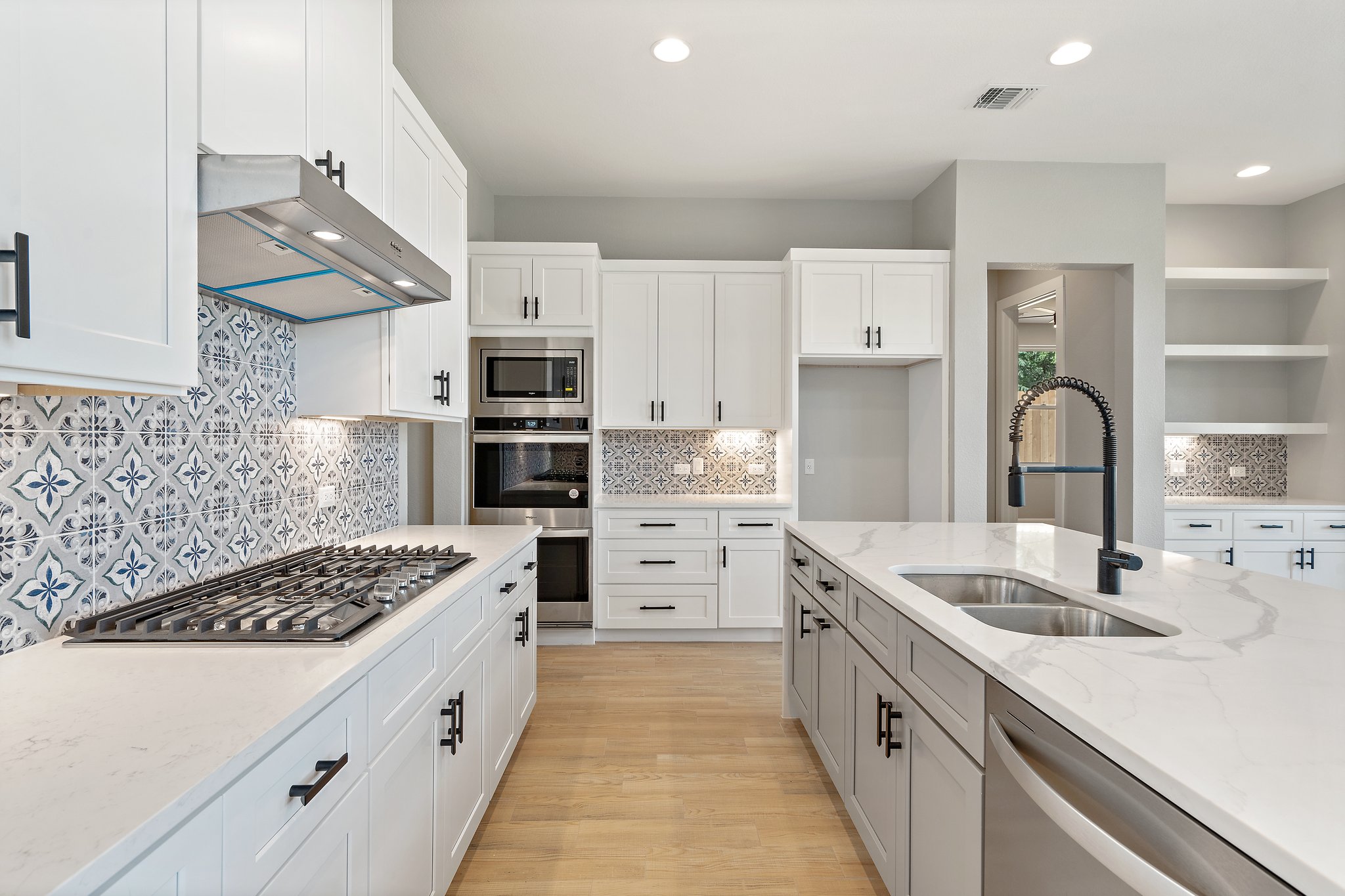 308 Axis Loop Georgetown, TX 78628 - Photo 17 of 40 a kitchen with white cabinets and appliances