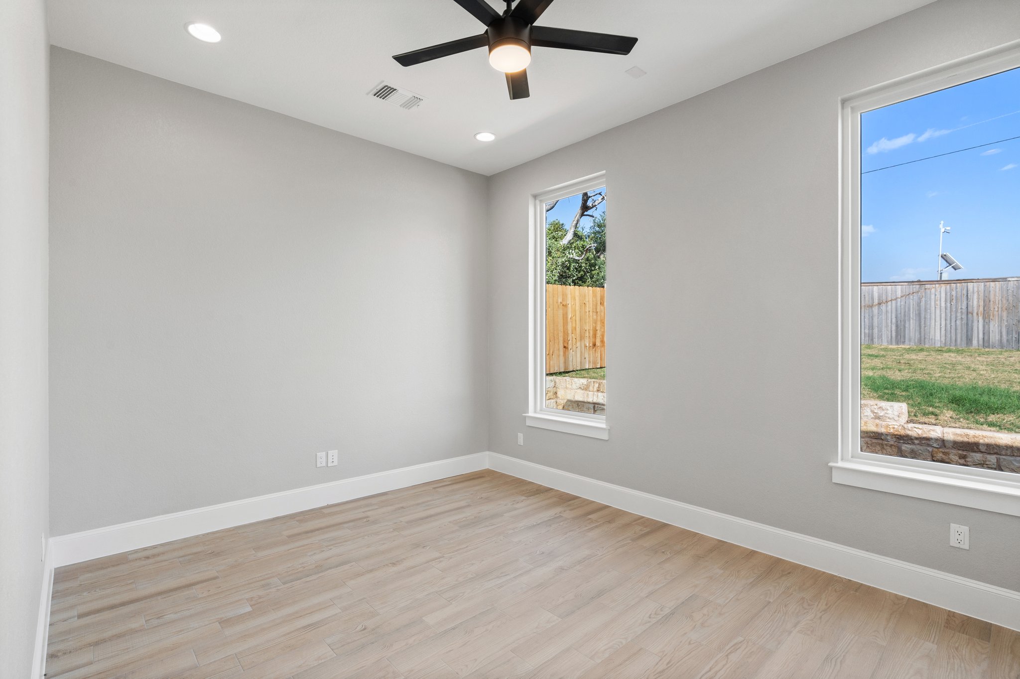 308 Axis Loop Georgetown, TX 78628 - Photo 22 of 40 wooden floor in an empty room with a window
