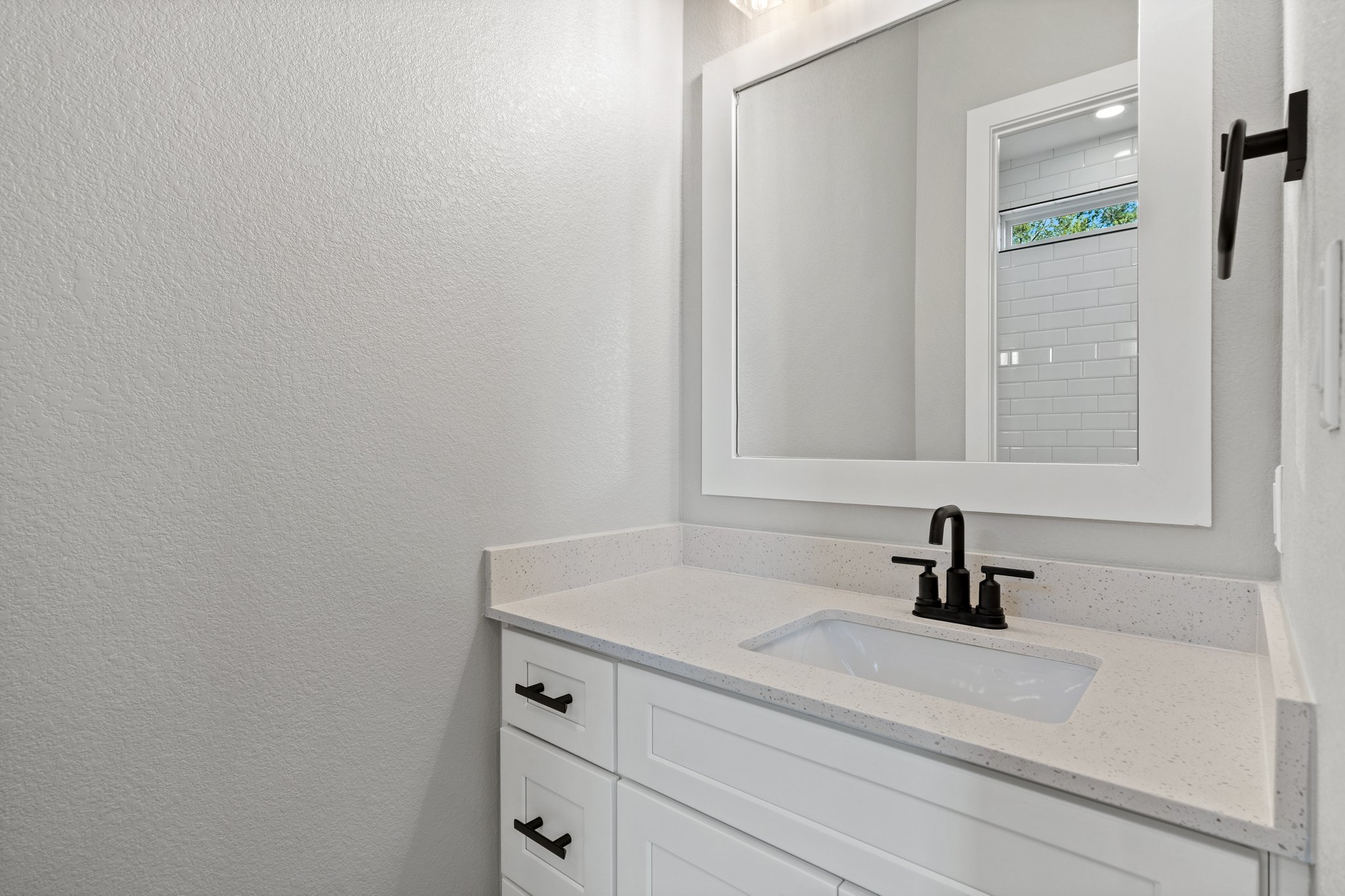 308 Axis Loop Georgetown, TX 78628 - Photo 28 of 40 a bathroom with a sink and a mirror