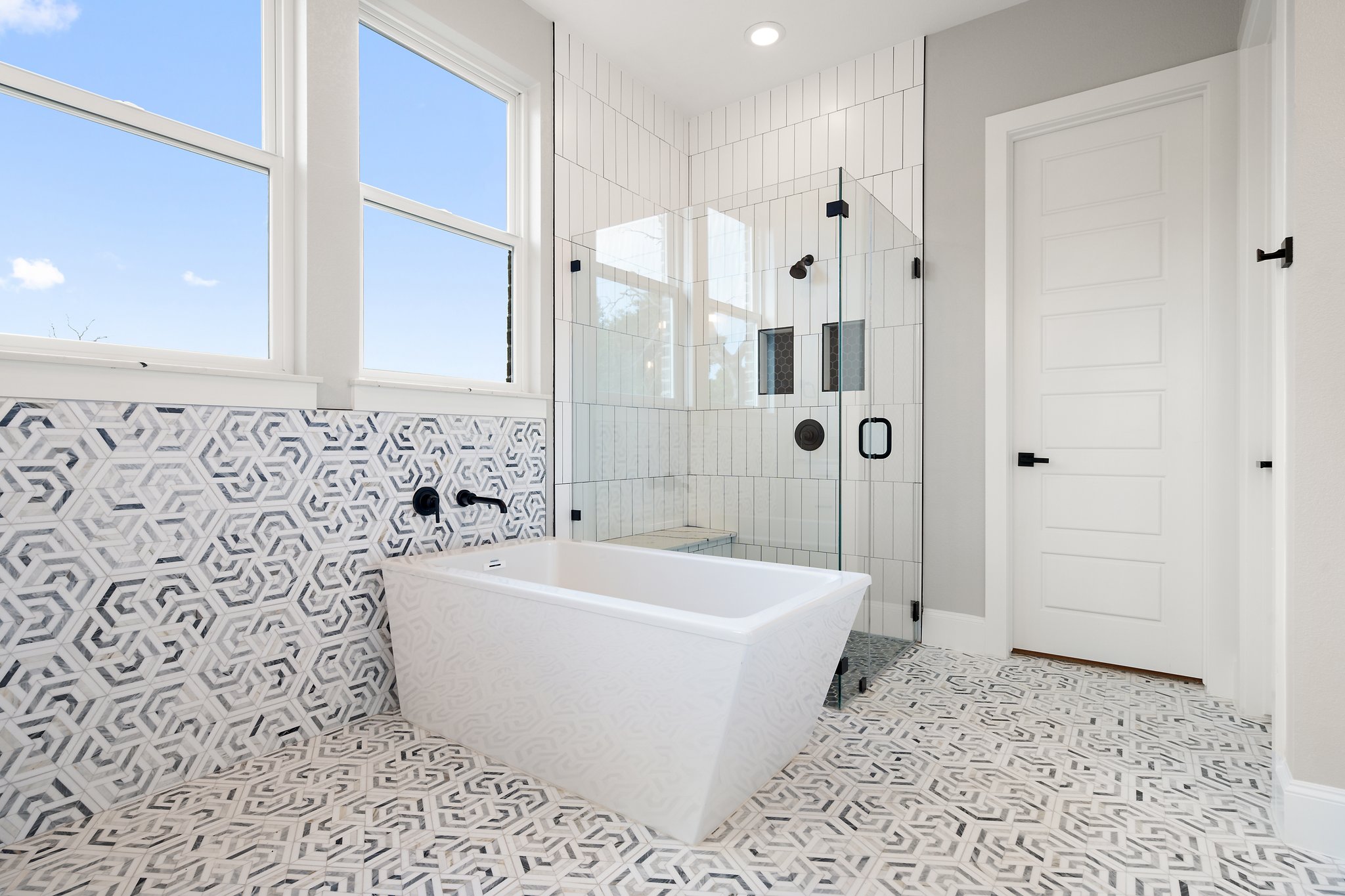 308 Axis Loop Georgetown, TX 78628 - Photo 33 of 40 a white bath tub sitting in a bathroom with shower