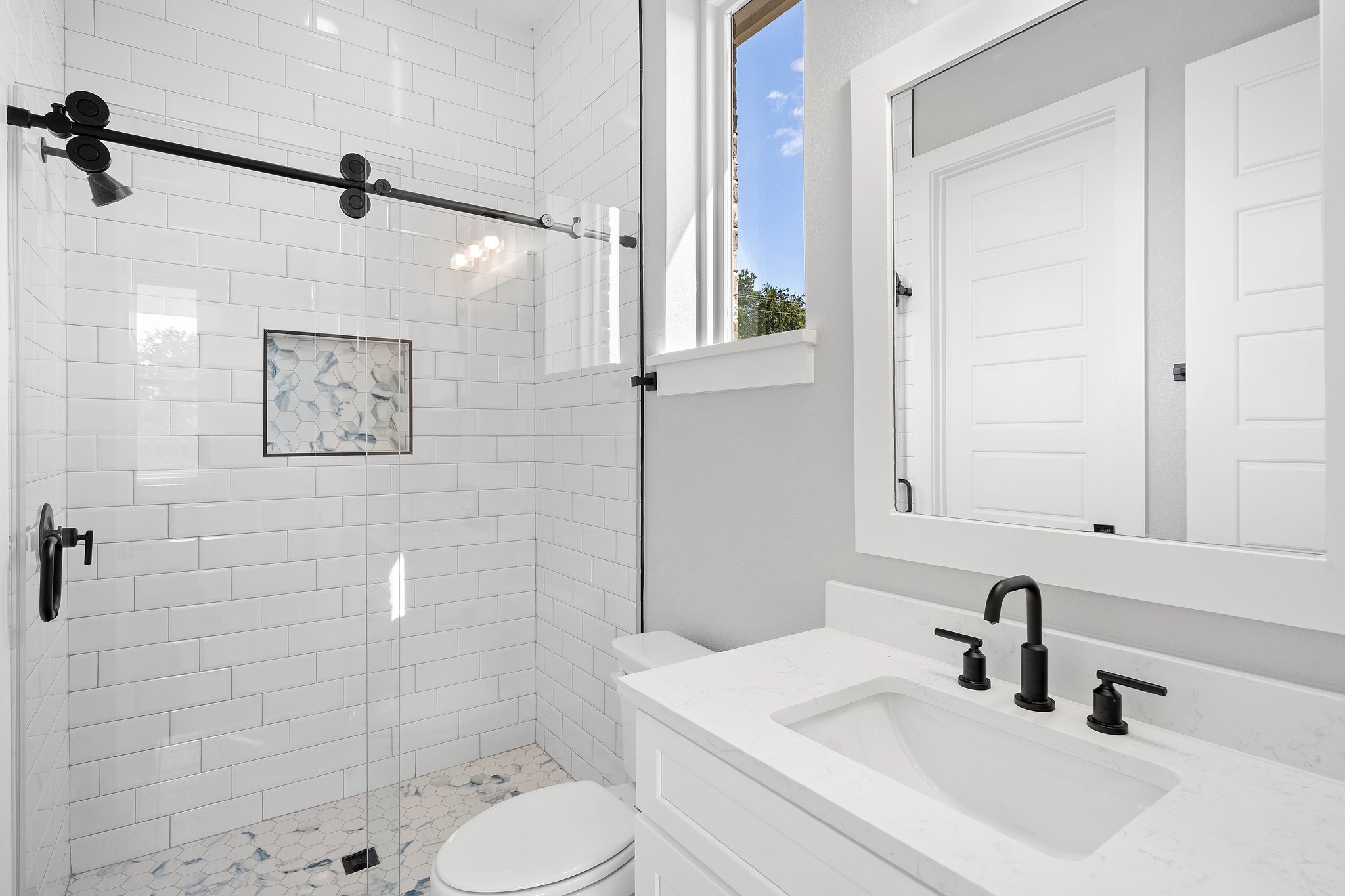 308 Axis Loop Georgetown, TX 78628 - Photo 8 of 40 a bathroom with a sink toilet and shower