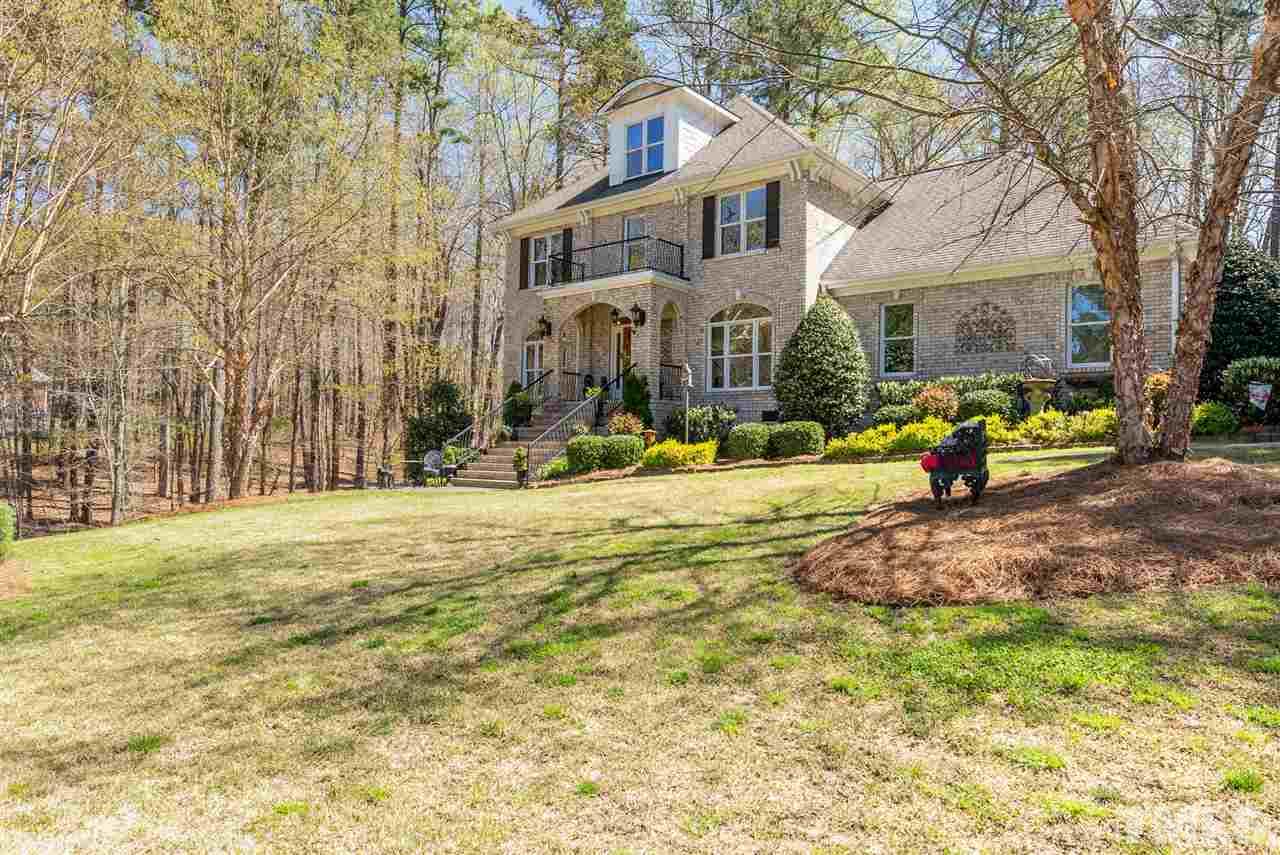 5512 Strathmore Drive Raleigh, NC 27613 - Photo 2 of 3 a front view of a building with street view