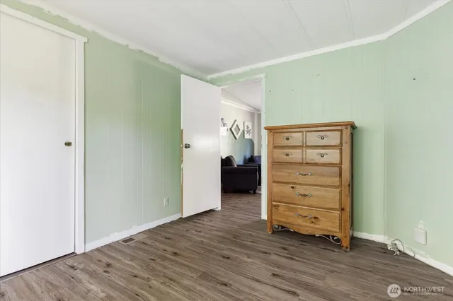 an empty room with wooden floor