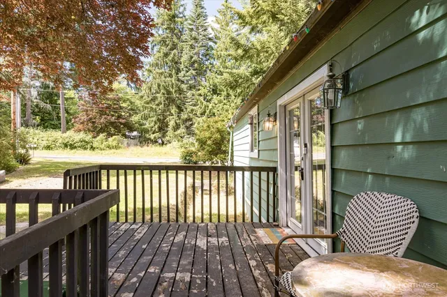 a view of balcony with wooden floor