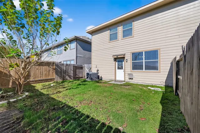 a view of a back yard of the house