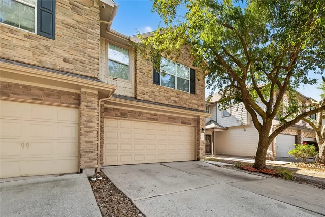 front view of a house with a trees
