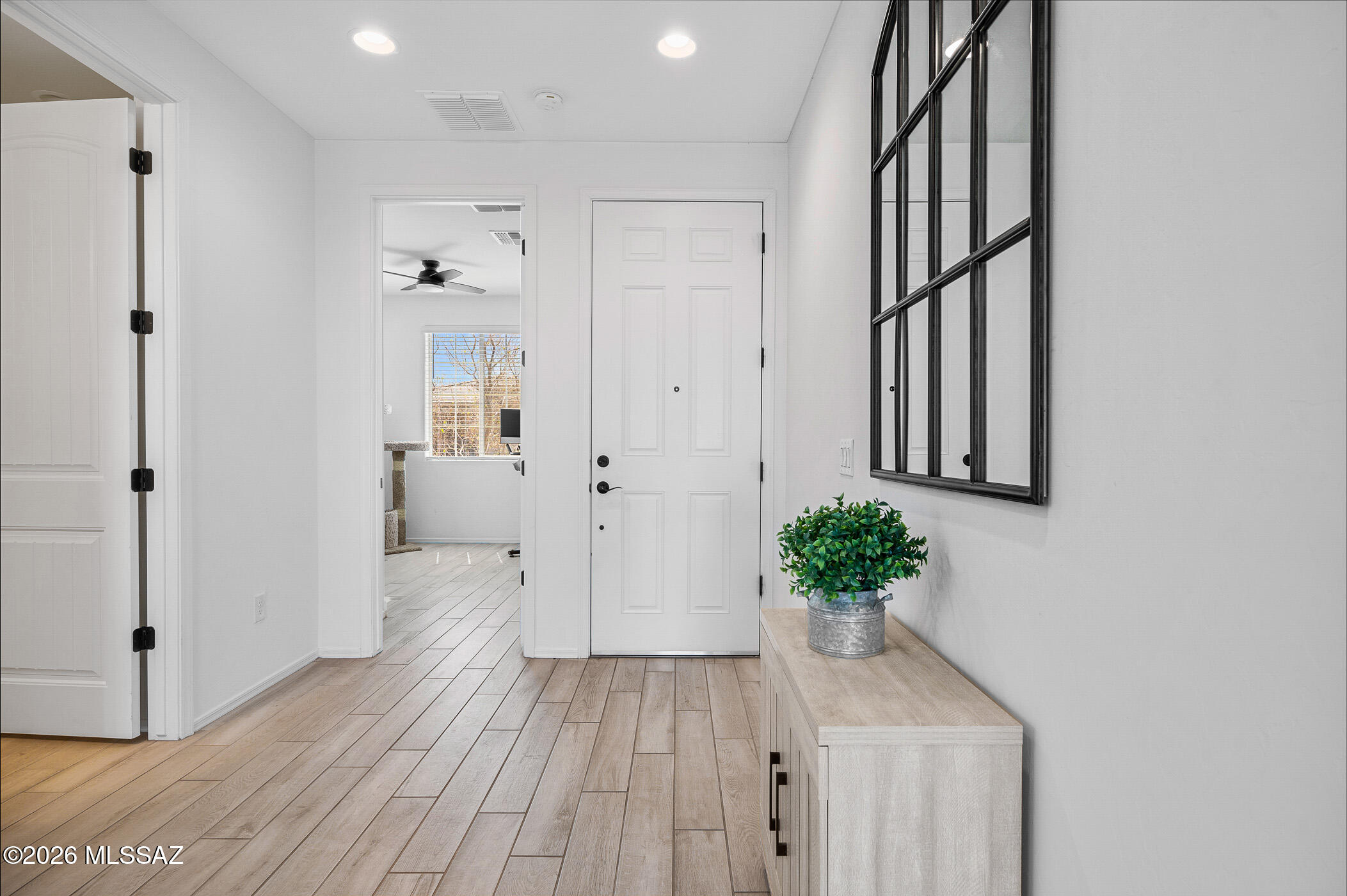 12092 East Ryscott Circle Vail, AZ 85641 - Photo 20 of 49 a view of a hallway with wooden floor and staircase