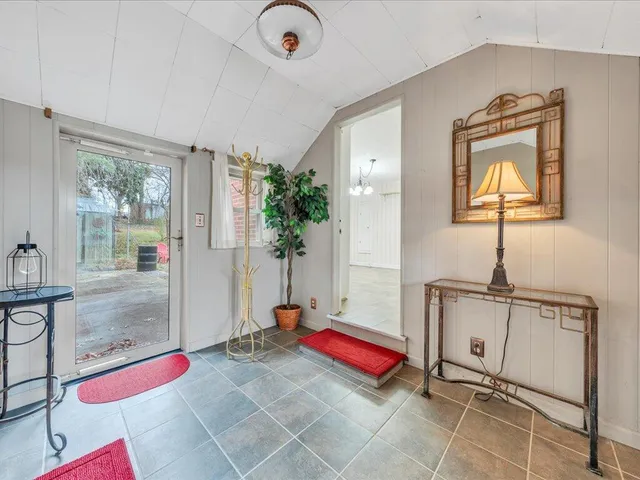 a room with gym equipment and a table