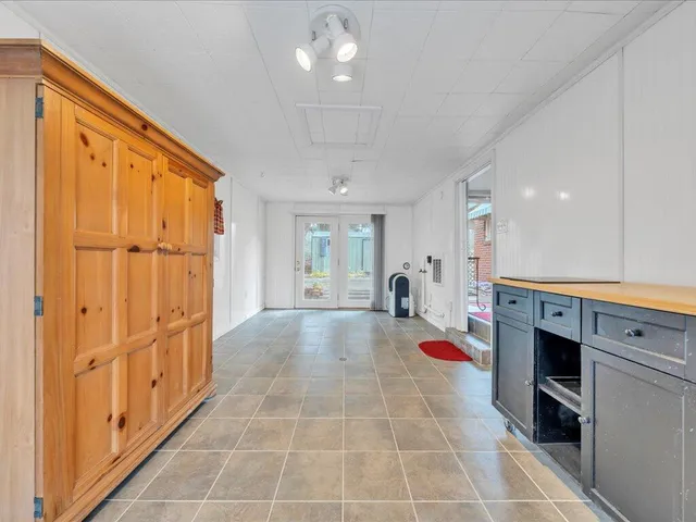 a view of a hallway with washer and dryer