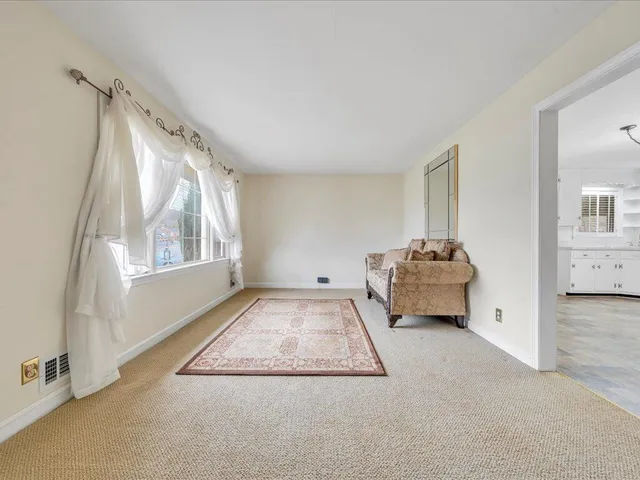 a view of livingroom with furniture and windows