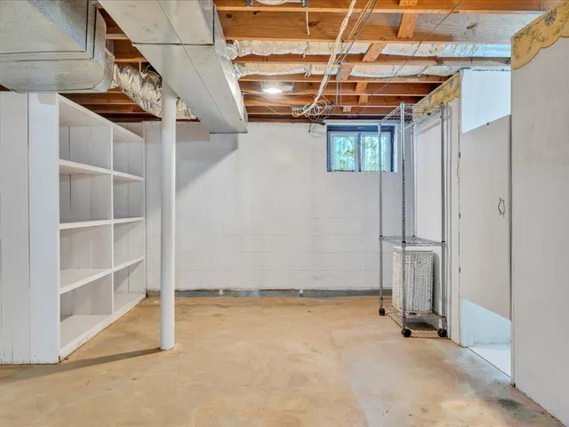 a view of a room with wooden walls
