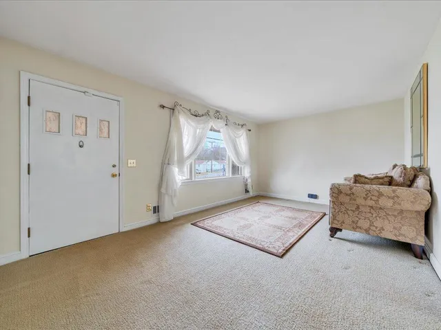 a view of an empty room and window