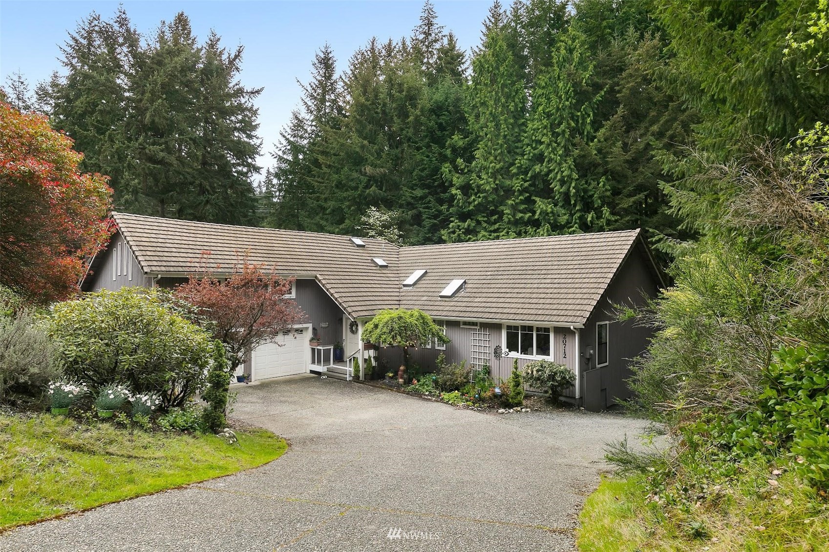 20712 29th Avenue Southeast Bothell, WA 98021 - Photo 1 of 40 front view of a house with a yard and potted plants